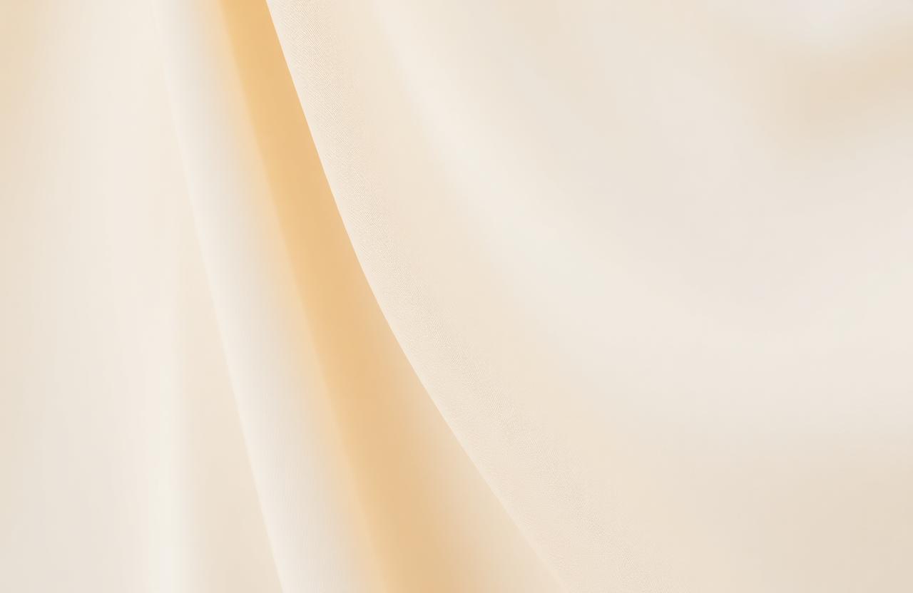 Soft skin-toned silk drape representing stretch mark camouflage